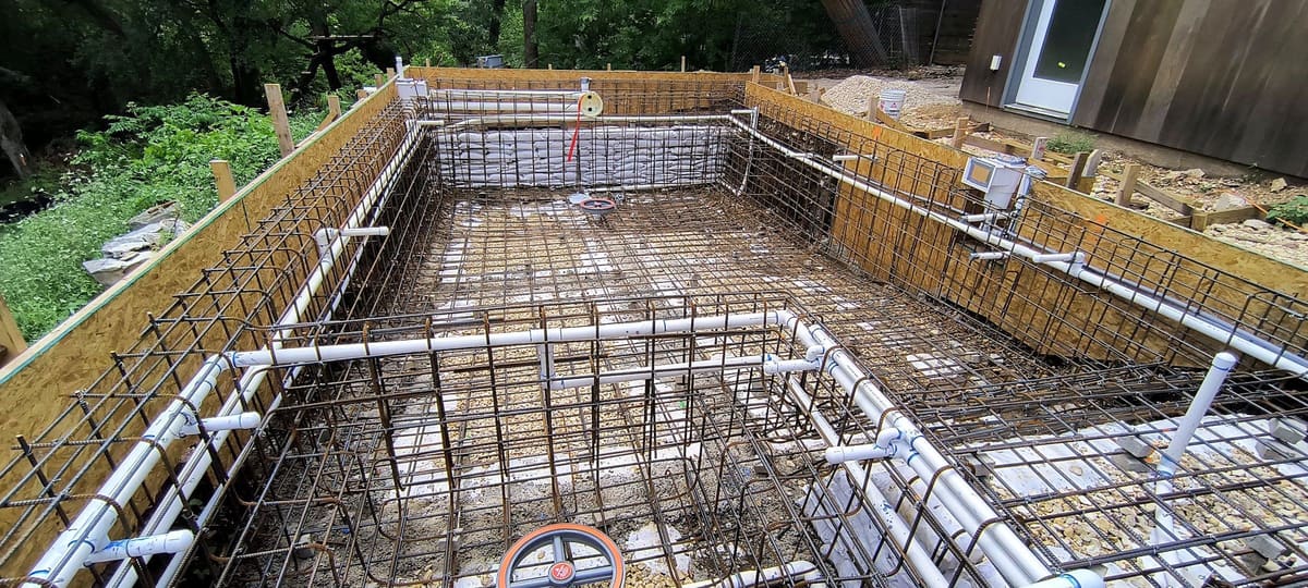 Pool shell reinforcing steel tied in place during construction