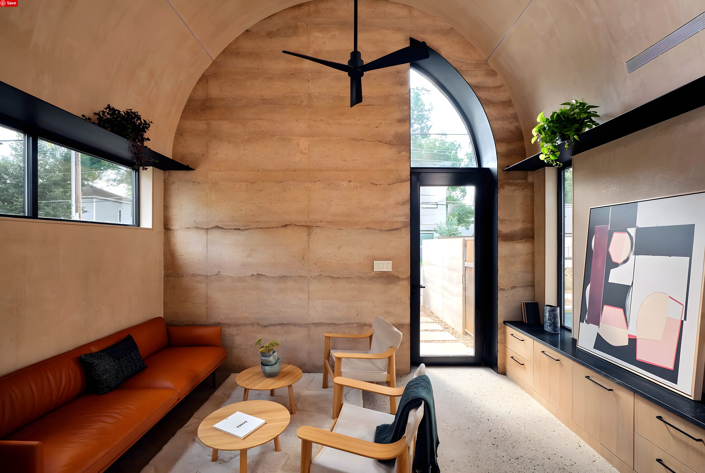 Desoluna — Rammed-earth walls and arched openings — structural engineering for a material most practices never model.