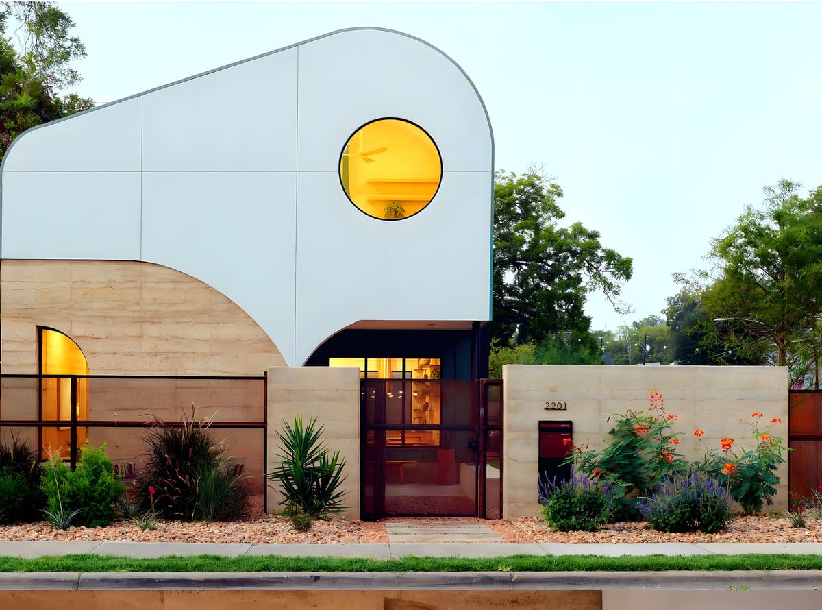 Terraluz — Curved rammed-earth walls, barrel-vaulted roofs, custom steel, and an elevated bridge.